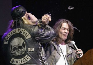Zakk Wylde and Eddie Van Halen make a toast at 'Dimebag' Darrell Abbott's public memorial service