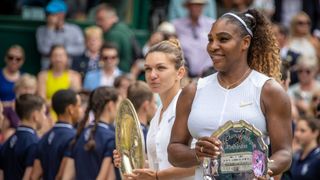 Serena Williams of the United States stands next to Simona Halep of Romania after the Ladies Singles Final on Centre Court during the Wimbledon Lawn Tennis Championships at the All England Lawn Tennis and Croquet Club at Wimbledon on July 13, 2019