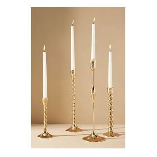 assortment of gold candle holders