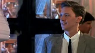 Andrew McCarthy in a suit and tie, smiling in Less Than Zero