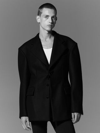 Model wears jacket by Louis Vuitton A/W 2022 menswear