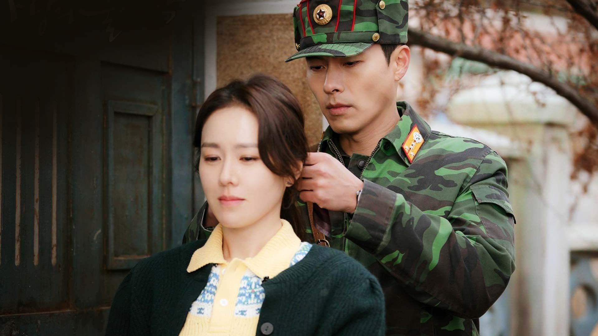 a North Korean soldier (Hyun Bin) ties up a woman&apos;s (Son Ye-jin) hair,...