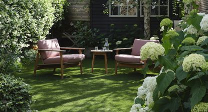 backyard with armchairs and coffee table