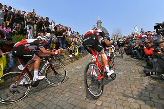 Trek-Segafredo's Mads Pedersen and Edward Theuns climb the Muur van Geraardsbergen during the Tour of Flanders