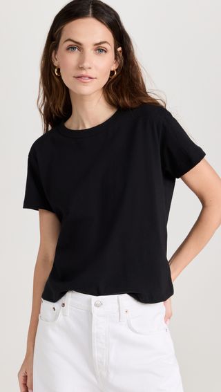 a model wears a black T-shirt