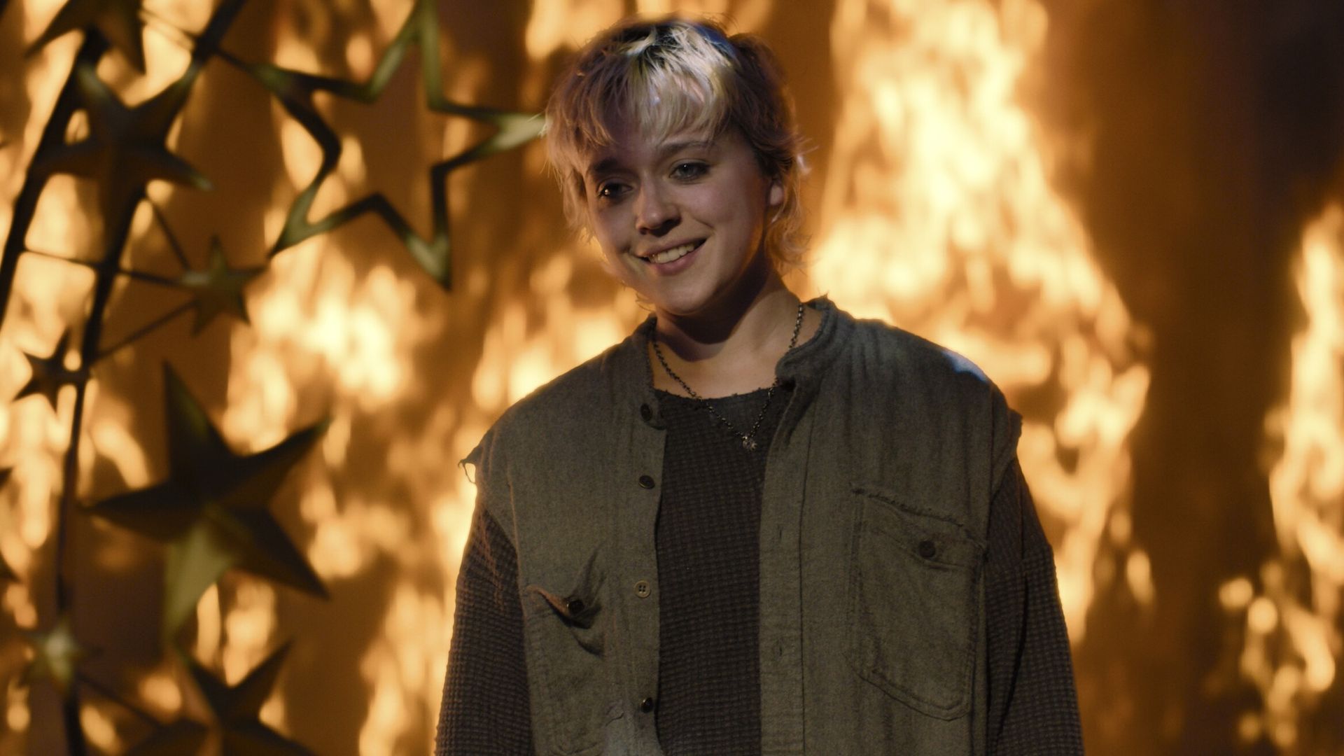 Emaline in front of the burning stage in Carrie