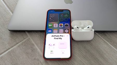 AirPods Pro 2 tips LEDE image showing AirPods and iPhone next to MacBook