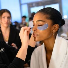 woman wearing best under eye patches at fashion week