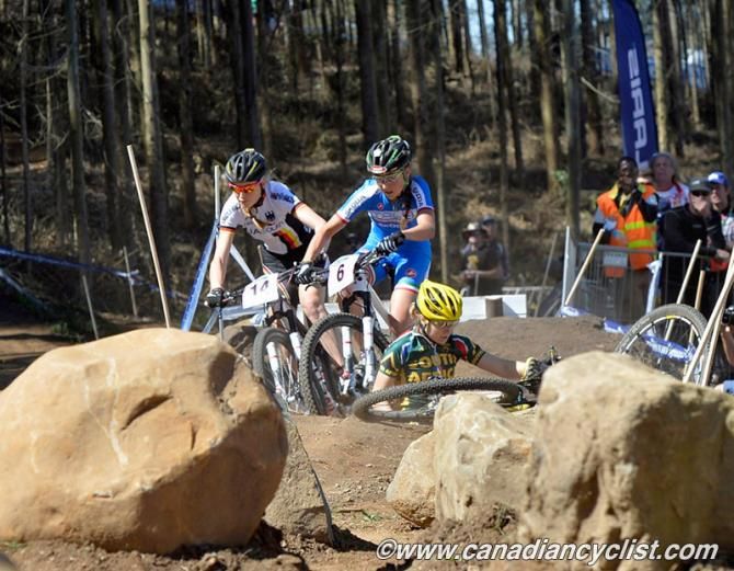 Eva Lechner and Helen Grobert jostle to ride around Mariske Strauss (South Africa), who crashed on the rocks