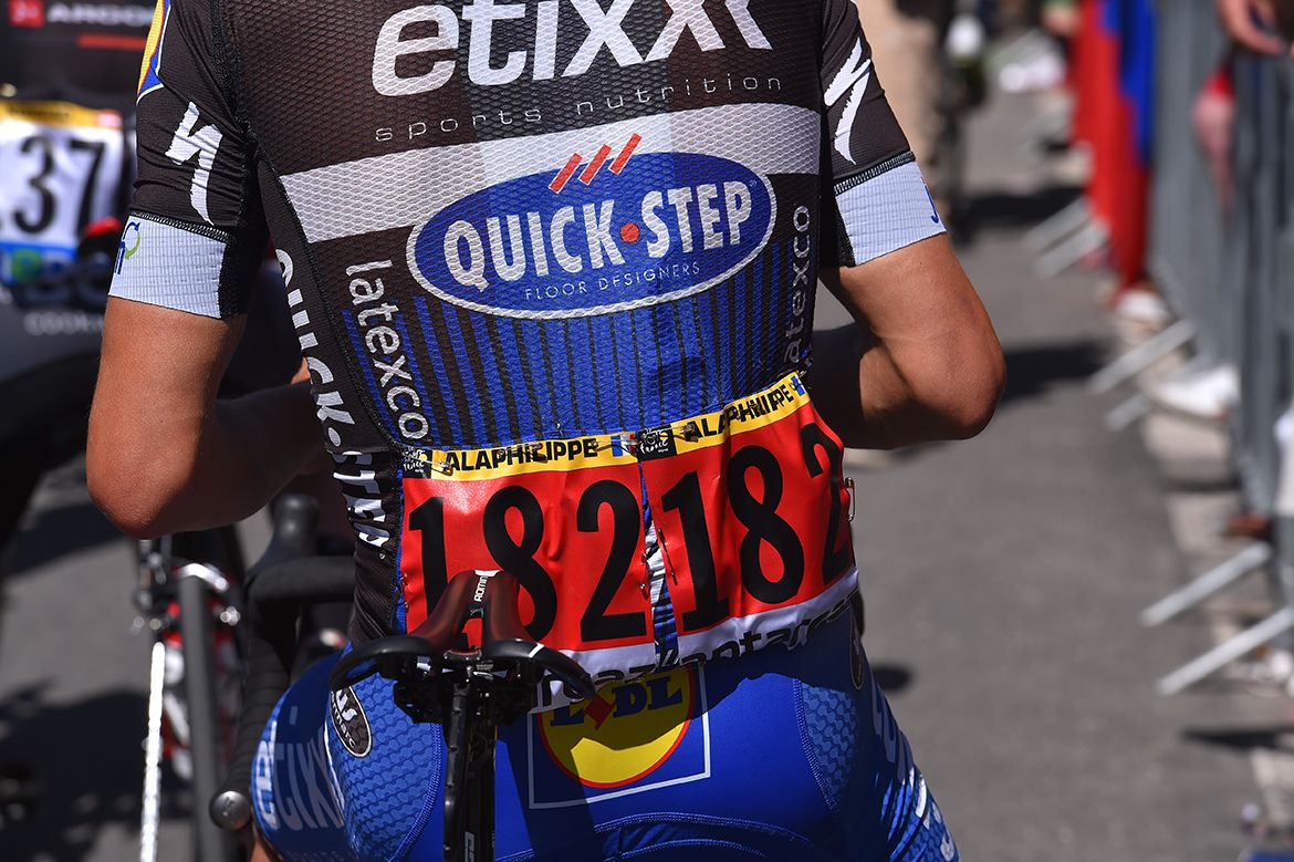 Julian Alaphilippe (Etixx-Quickstep) wears the red number of the previous stage's combativity prize