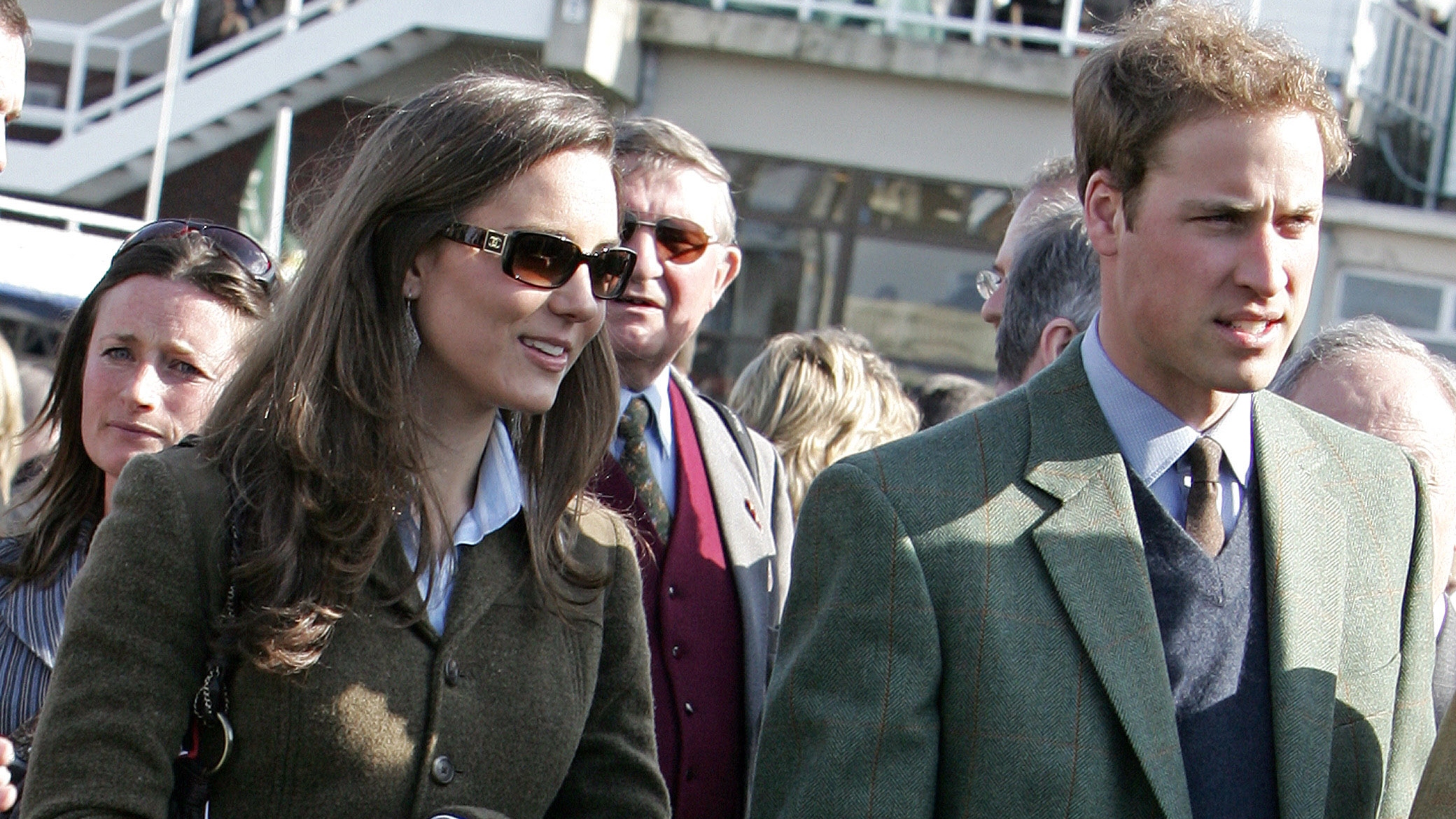 Prince William stands beside Kate in the paddock enclosure on the first day of the Cheltenham Race Festival at Cheltenham Race course, in Gloucestershire 13 March 2007