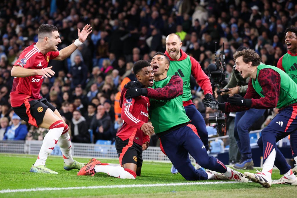 Amad Diallo of Manchester United celebrates with teammates after scoring their side&#039;s second goal during the Premier League match between Manchester City FC and Manchester United FC at Etihad Stadium on December 15, 2024 in Manchester, England. 