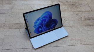 A photograph of the Microsoft Surface Studio Laptop in Stage mode