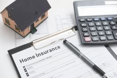 Home insurance form on the table. Assurance and home safety concept.