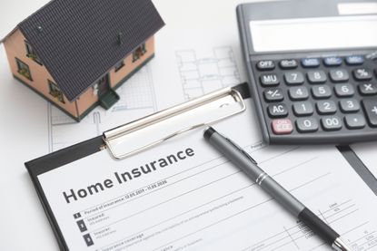 Home insurance form on the table. Assurance and home safety concept.