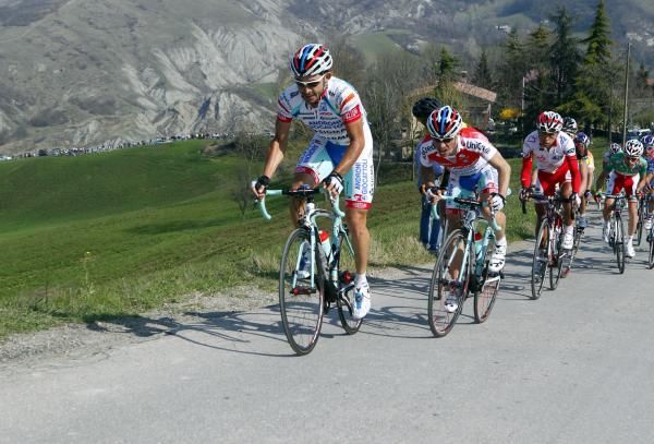 Sella hangs on to his teammates wheel