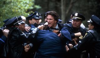 Mystic River angry Sean Penn is restrained by cops
