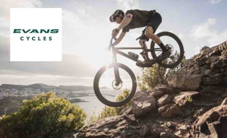 evans cycles logo top left with a man mountain biking