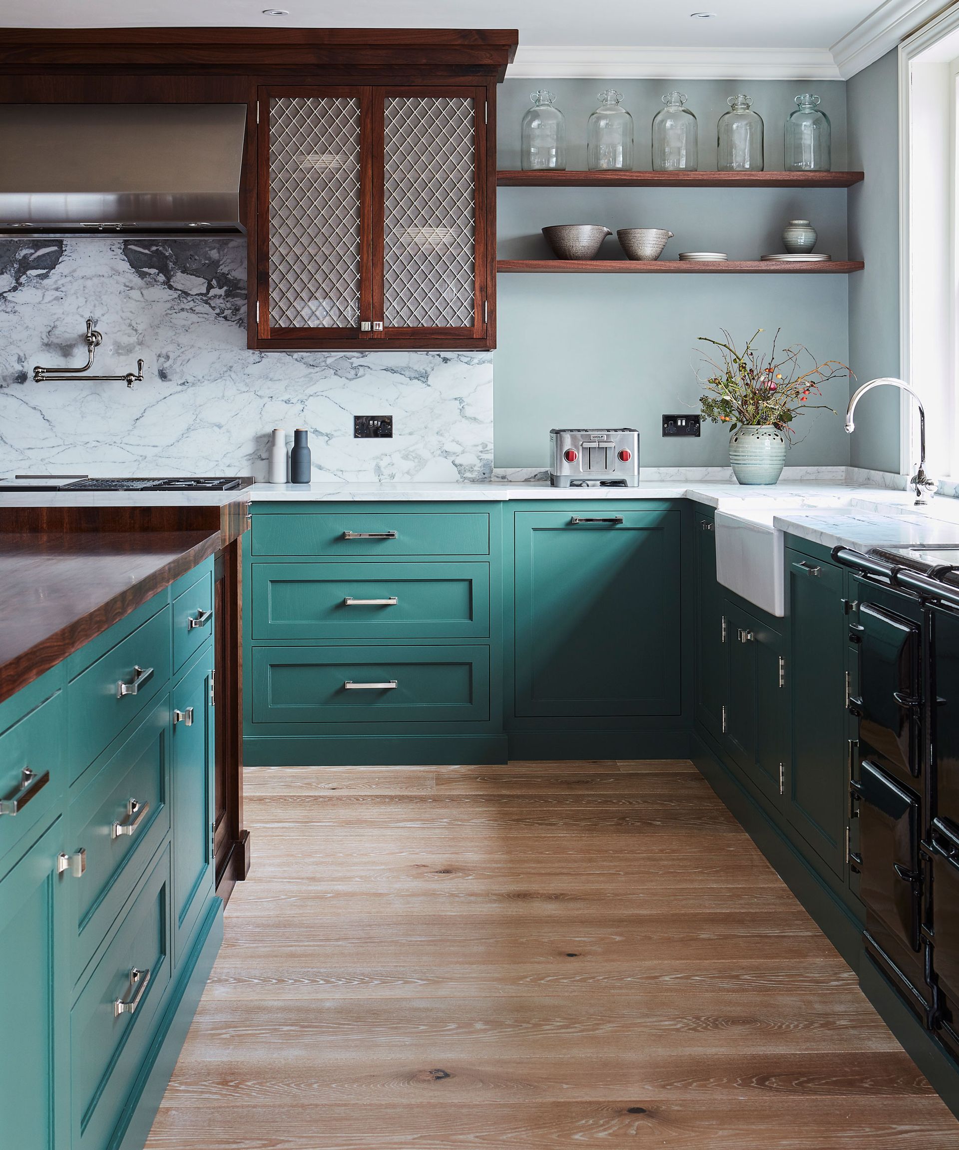 Kitchen layout ideas in a teal scheme with marble backsplash and open shelving.