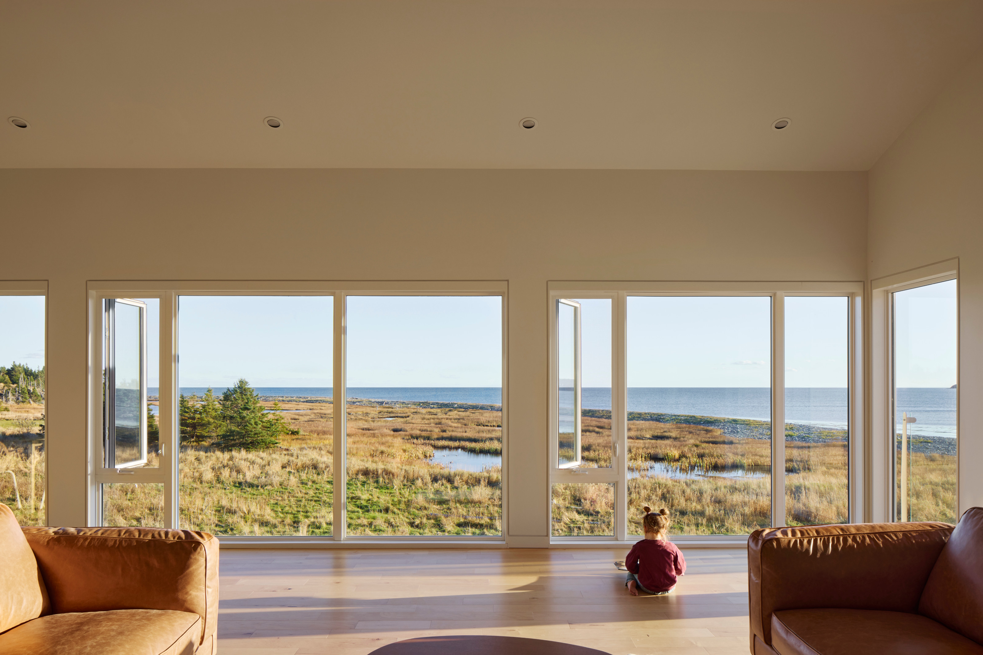 The living room is on the first floor, offering unobstructed Atlantic views