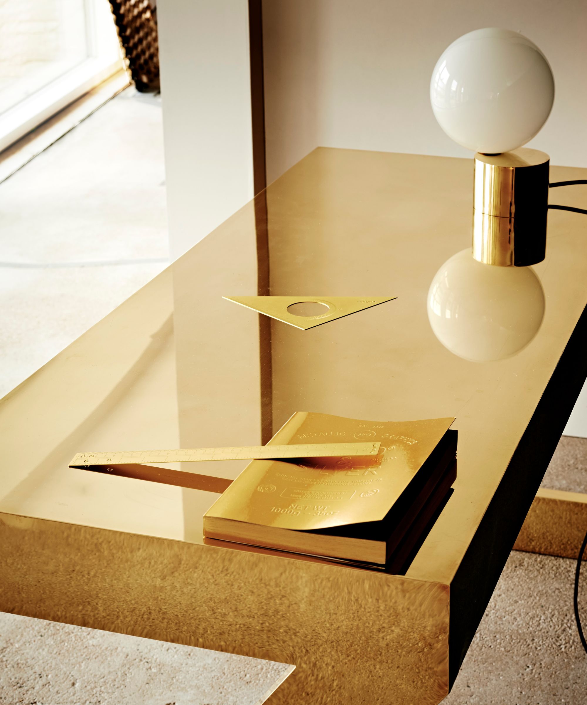 Rectangular gold table with gold lamp