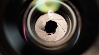 Closeup of lens aperture blades damaged by exposure to the sun from the 2017 solar eclipse, damaged rental gear returned to Lensrentals