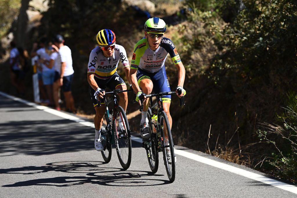 NAVACERRADA SPAIN SEPTEMBER 10 LR Sergio Andres Higuita Garcia of Colombia and Team Bora Hansgrohe and Louis Meintjes of South Africa and Team Intermarch Wanty Gobert Matriaux compete in the breakaway during the 77th Tour of Spain 2022 Stage 20 a 181km stage from Moralzarzal to Puerto de Navacerrada 1851m LaVuelta22 WorldTour on September 10 2022 in Puerto de Navacerrada Spain Photo by Tim de WaeleGetty Images