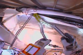 The view from astronaut Luca Parmitano's helmet camera as he cut a coolant line on the Alpha Magnetic Spectrometer