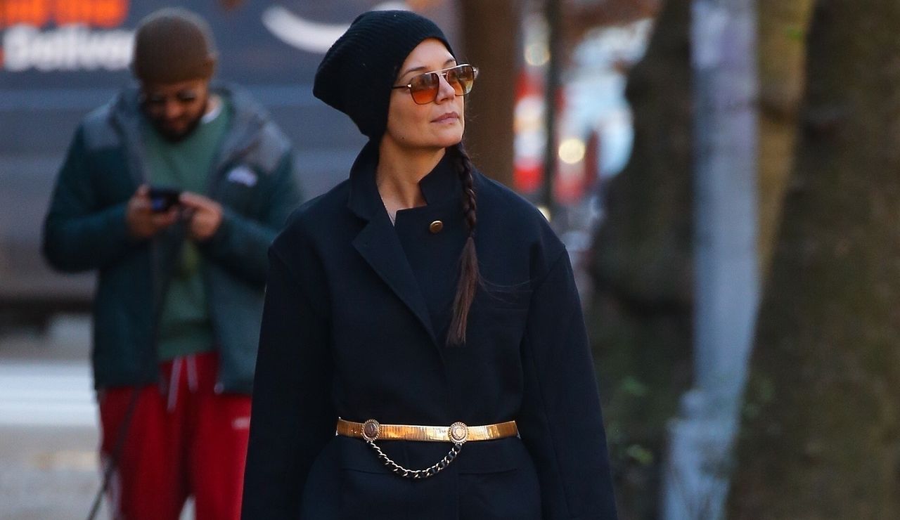 Katie Holmes walks around Manhattan on her birthday wearing a blue peacoat with a gold statement belt and jeans