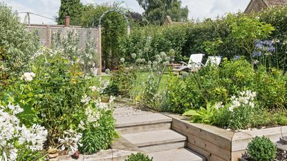 Green raised planters in terraced garden