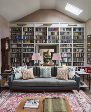 Traditional living room with bookcase and rug