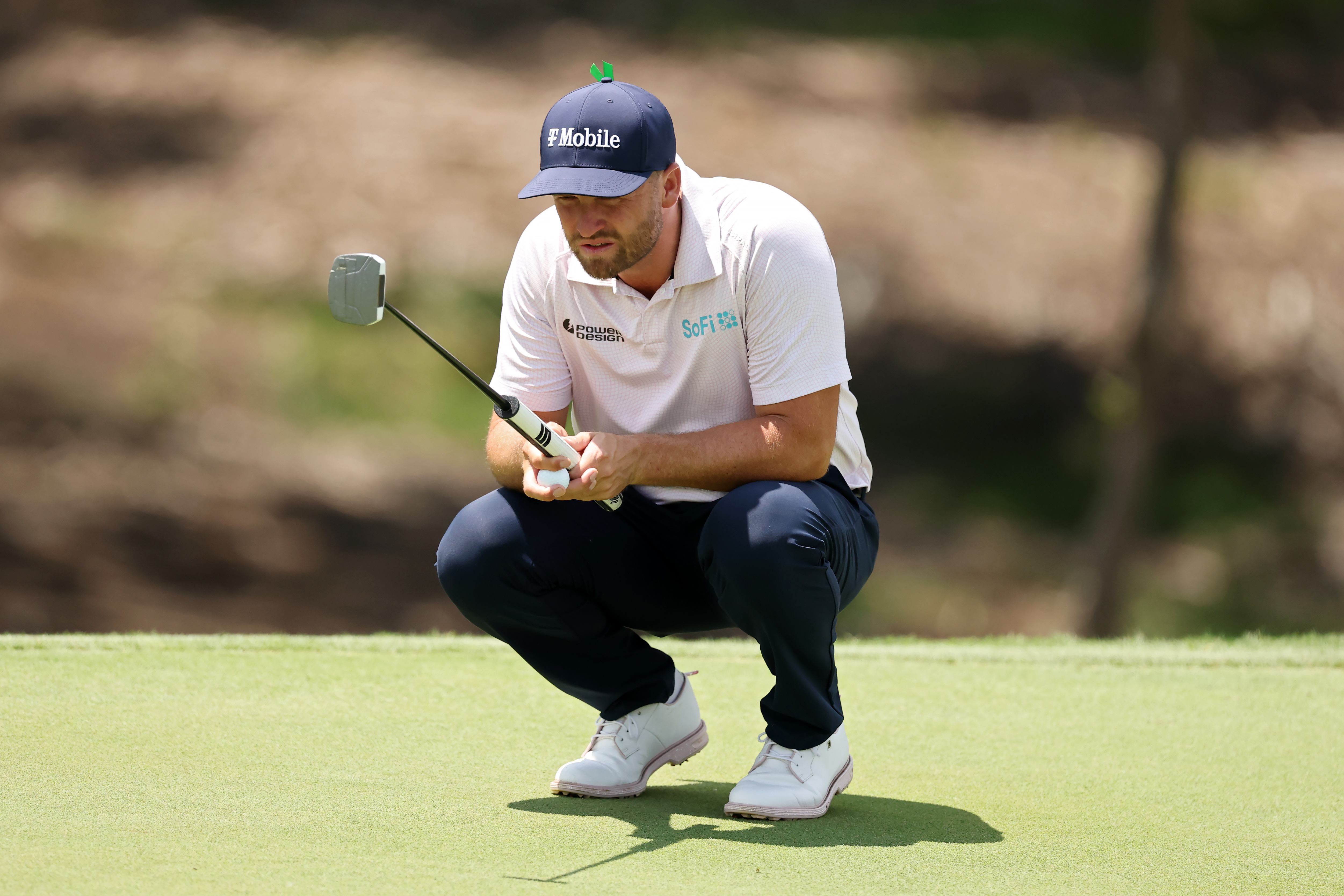 Wyndham Clark lines up a putt on the ninth green during the final round of The CJ Cup Byron Nelson