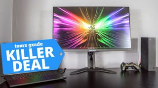 Gigabyte M28U monitor with deal tag superimposed