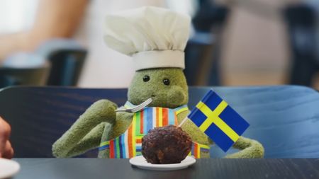An image of Tiny Chef puppet eating a falafel in Ikea x Tiny Chef ad