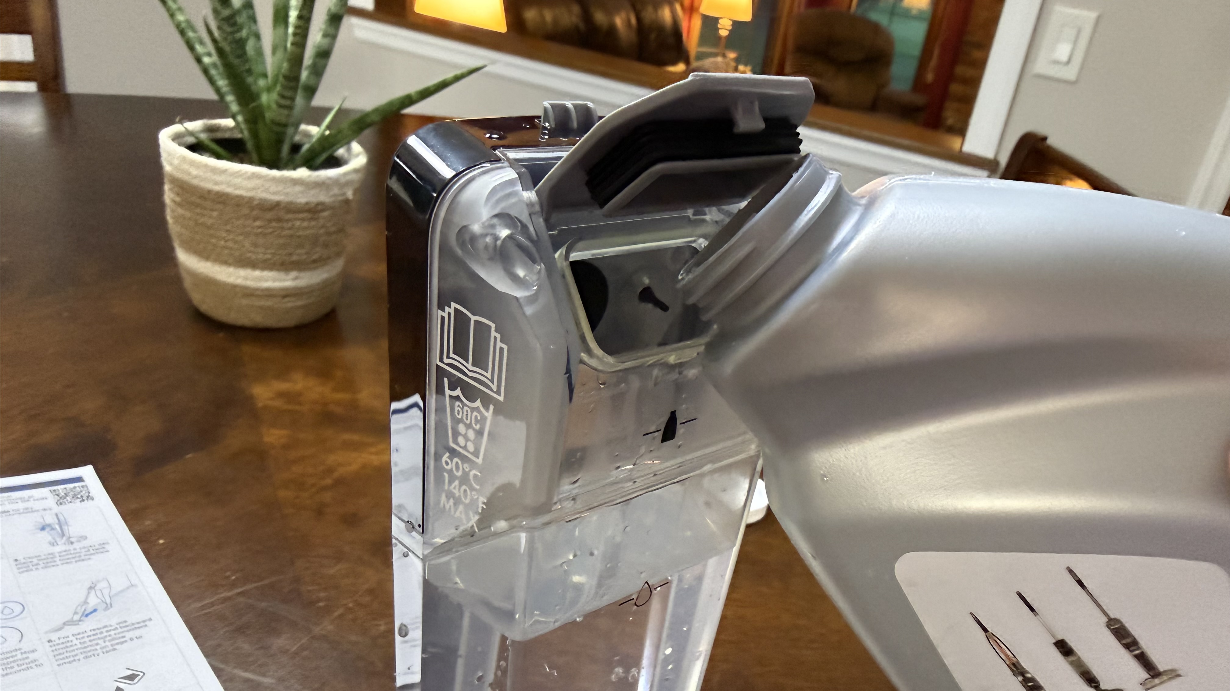 Bissell CrossWave HydroScrub All-in-One-Multi-Surface Cleaner adding cleaner to tank