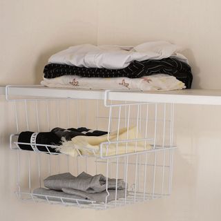 cloth rack storage with pink wall