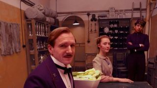 Ralph Fiennes, Tony Revolori, and Saoirse Ronan in The Grand Budapest Hotel