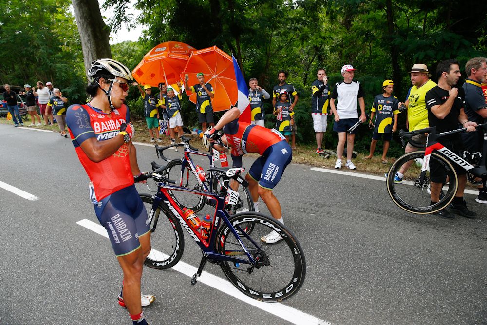 Yukiya Arashiro and Sonny Colbrelli get up after a crash during stage 11 at the Tour de France