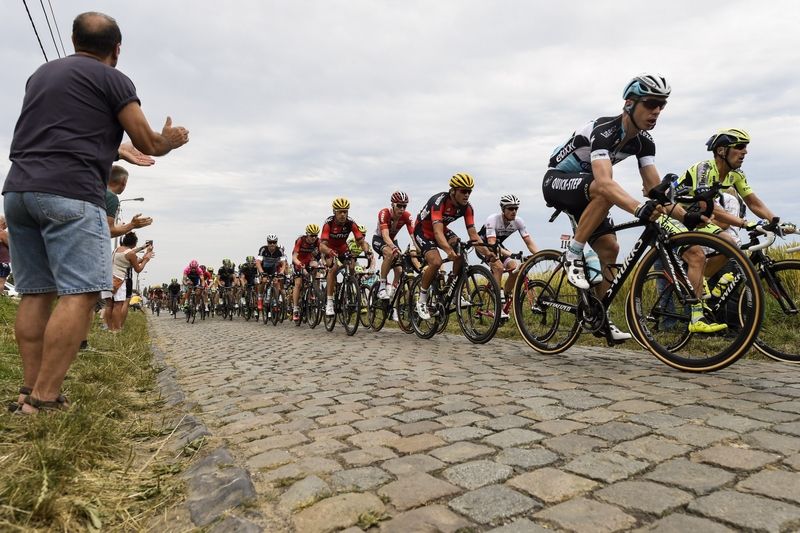 Tony Martin riding over the first pave sector