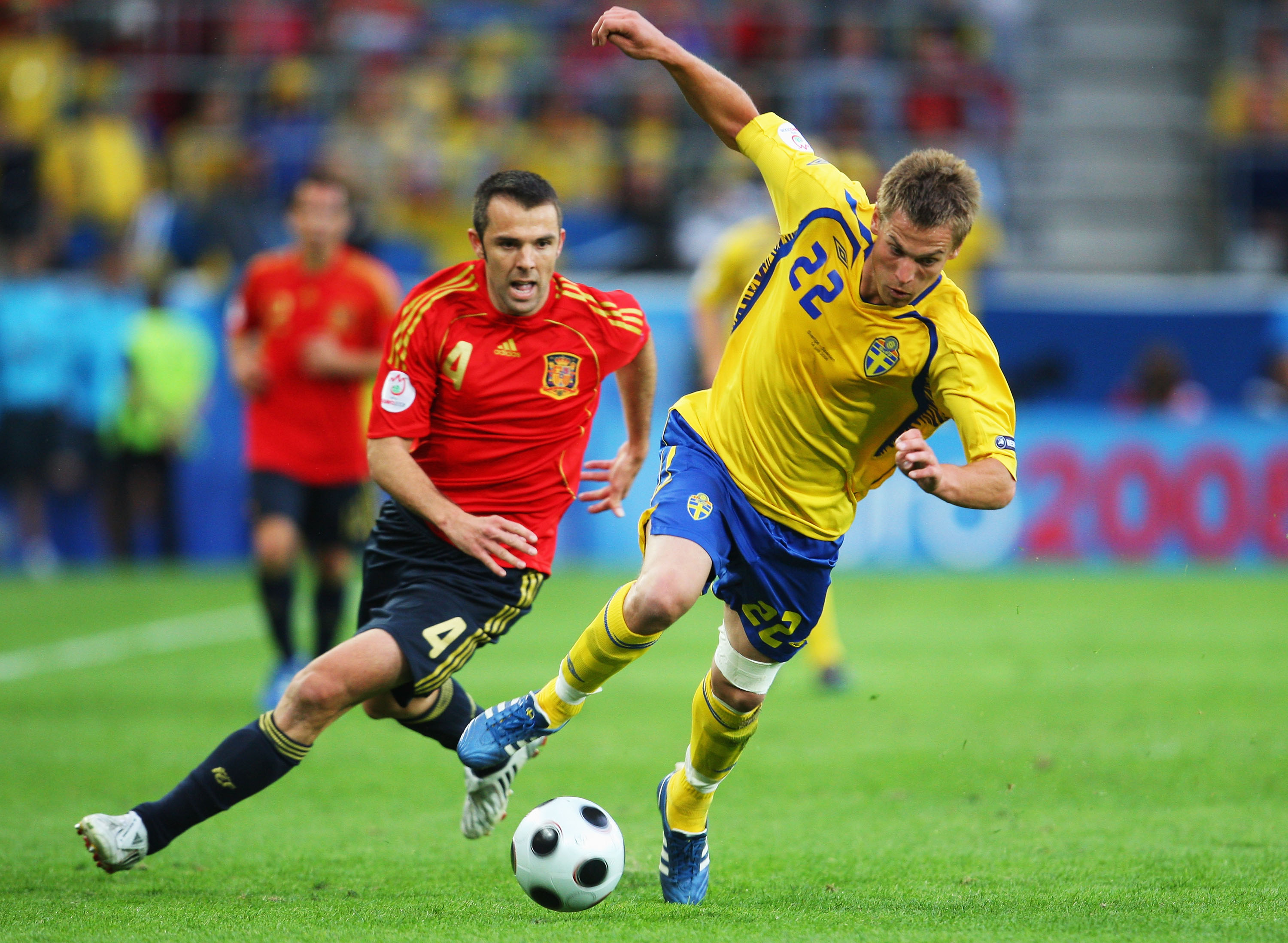 Spain's Carlos Marchena competes for the ball with Sweden's Markus Rosenberg at Euro 2008.