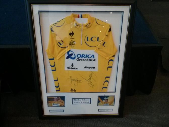 A 2013 yellow jersey signed by Daryl Impey and Simmon Gerrans