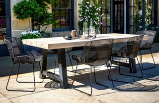 A wooden outdoor trestle dining table