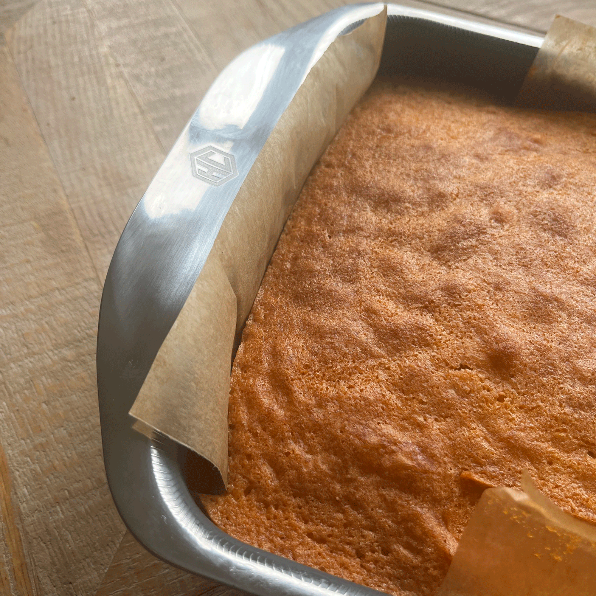 close up of a freshly baked cake in a HexClad baking tin