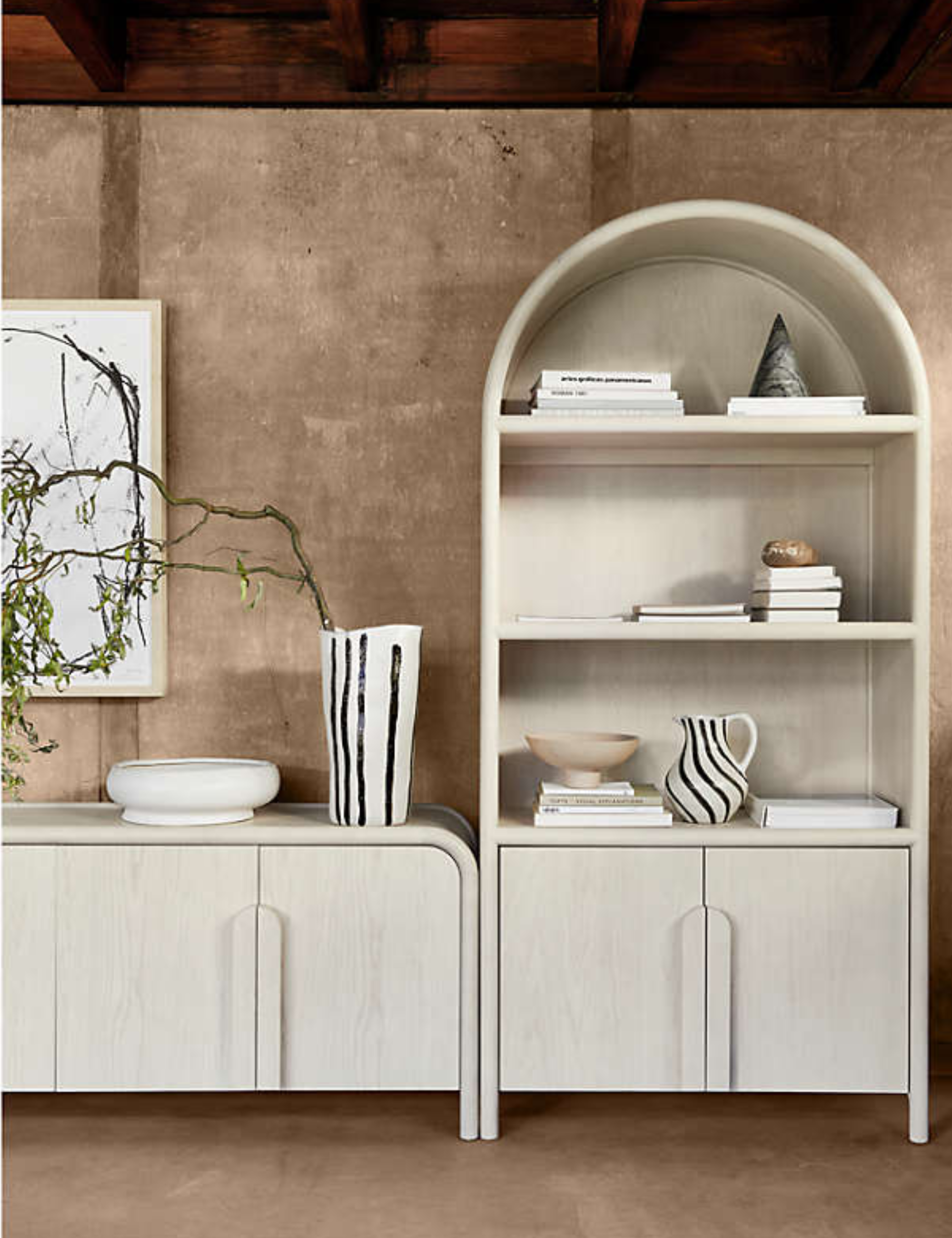 Crate &amp;amp; Barrel arched wooden bookshelf in a modern living room