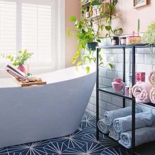 peach and blue bathroom with freestanding bath