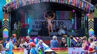 An artist performs on stage at Rainbow Row, a stretch of road to celebrate the LGBTQIA+ community at the London Marathon