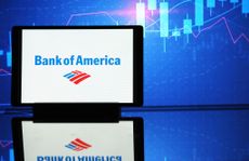 Bank of America logo on tablet with blue stock chart in background