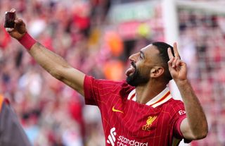 Mo Salah celebrates by taking a selfie after scoring for Liverpool against Tottenham, April 2025.