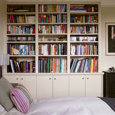 bedroom with cream bookcase