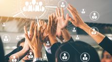 lots of hands reaching up to a central data image